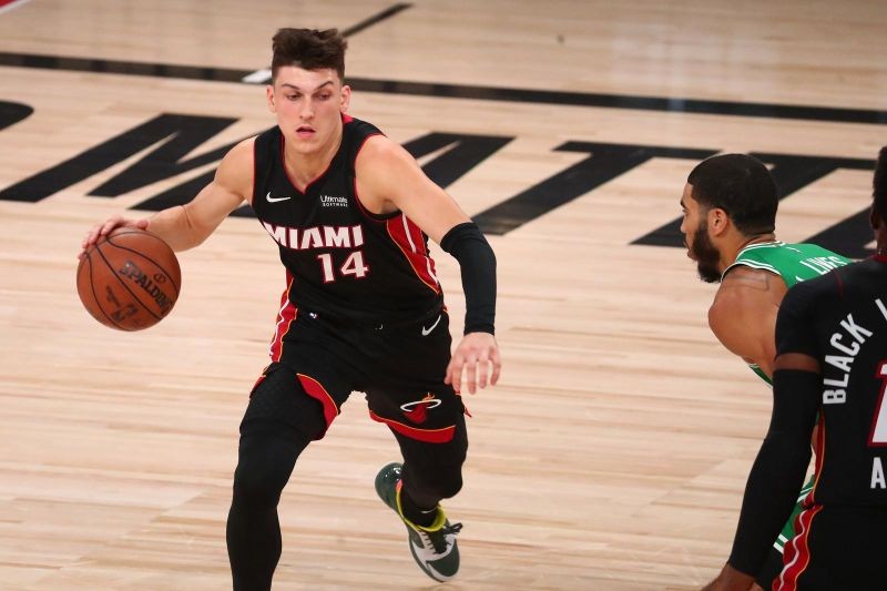 Miami Heat guard Tyler Herro (14) dribbles against Boston Celtics forward Jayson Tatum (right) during the first half of game four of the Eastern Conference Finals of the 2020 NBA Playoffs at AdventHealth Arena. (USA TODAY Sports Photo via Reuters)